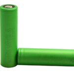 Two green 18650 lithium-ion batteries. Text on the batteries reads "DO NOT USE OUTSIDE BATTERY PACK.